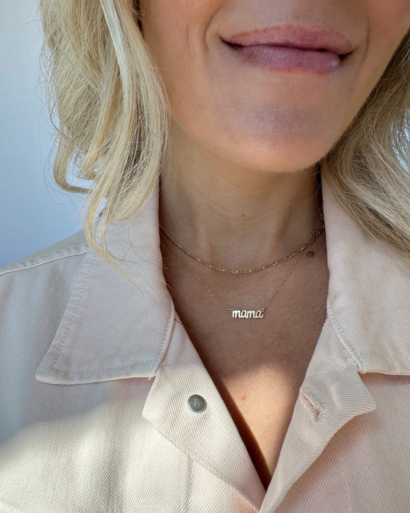 Elegant Mother’s Jewelry, created to celebrate motherhood and made in America by Katie Dean Jewelry, discover the dainty gold Mama Necklace.