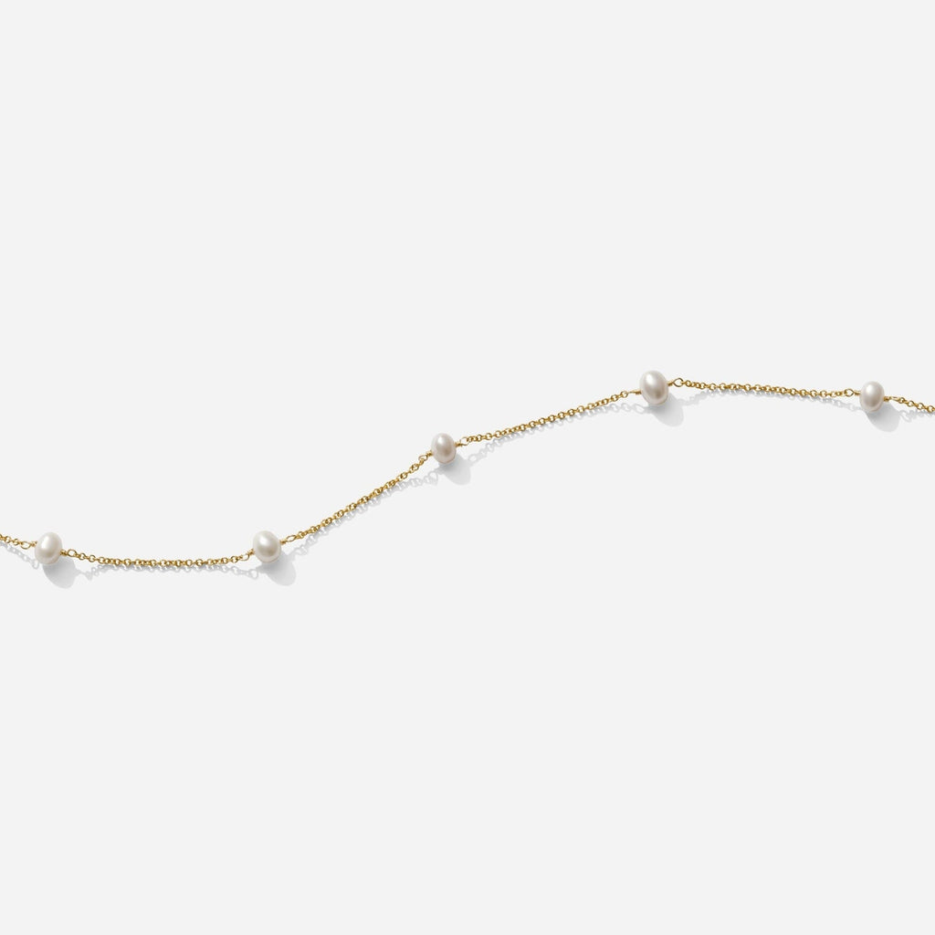 The Pearl Necklace as seen on a white background by Katie Dean Jewelry. Made in America.