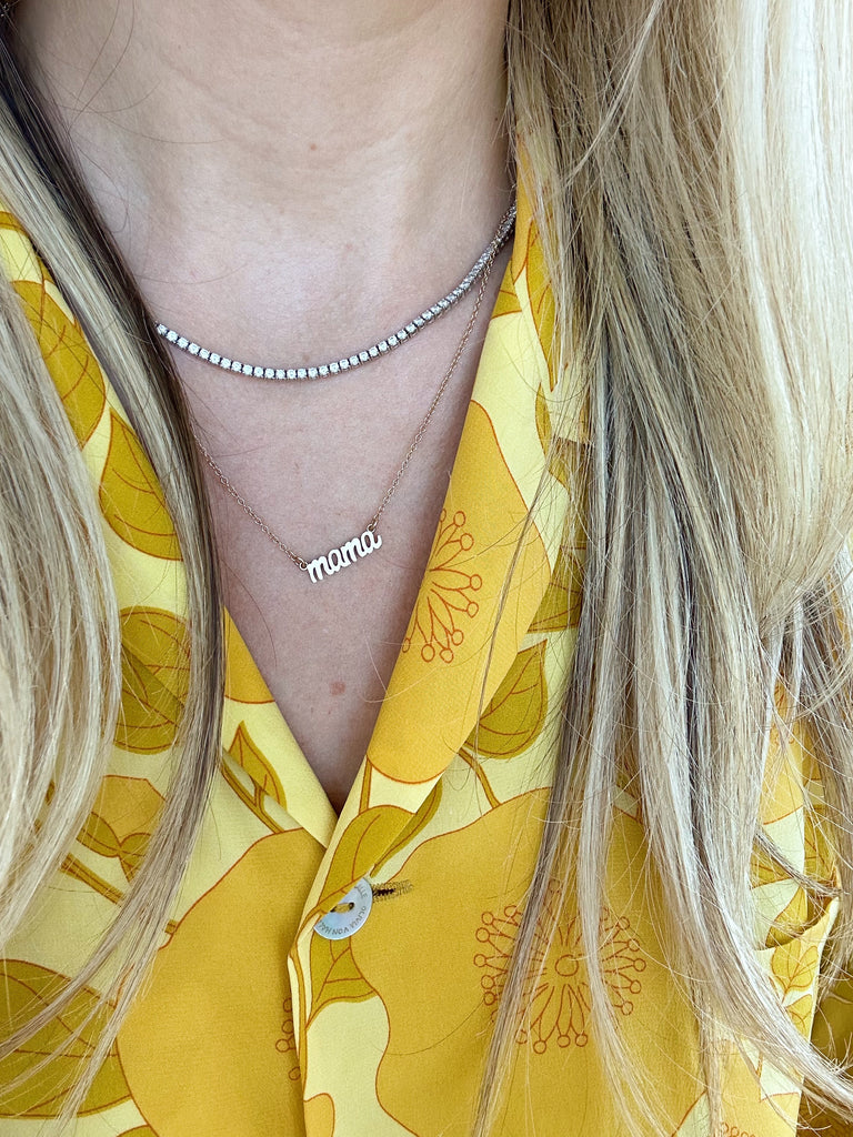 The dainty gold Mama Necklace as seen on Katie the founder of Katie Dean Jewelry with a diamond collar necklace layered above it, made in America by Katie Dean Jewelry, perfect for the minimalist.