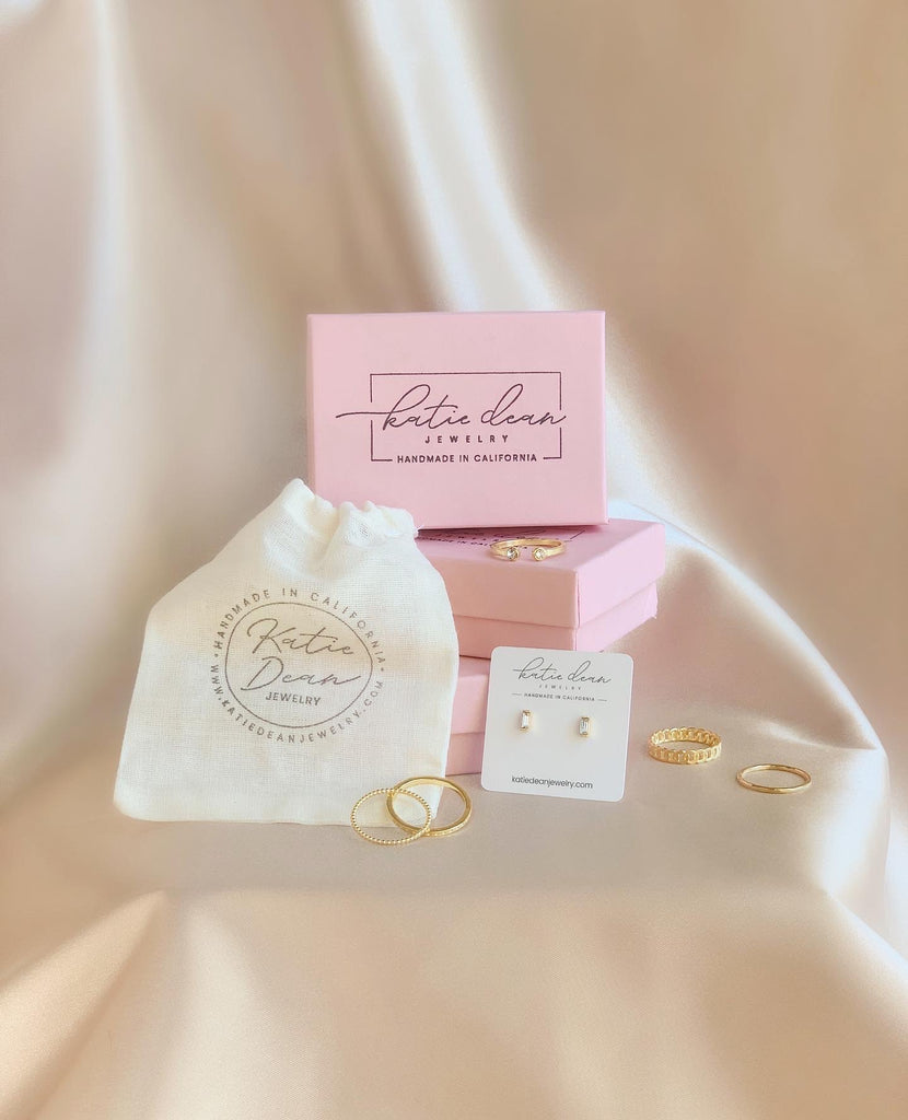 Katie Dean Jewelry branded drawstring pouch and boxes