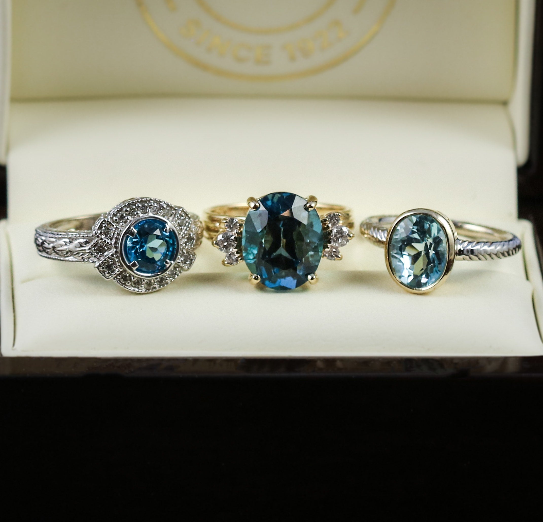 Blue topaz and diamond rings