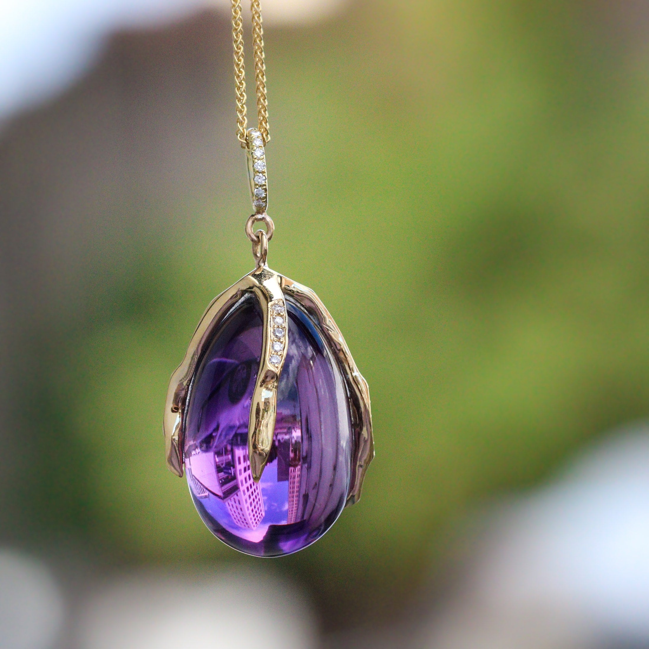 amethyst claw style pendant.