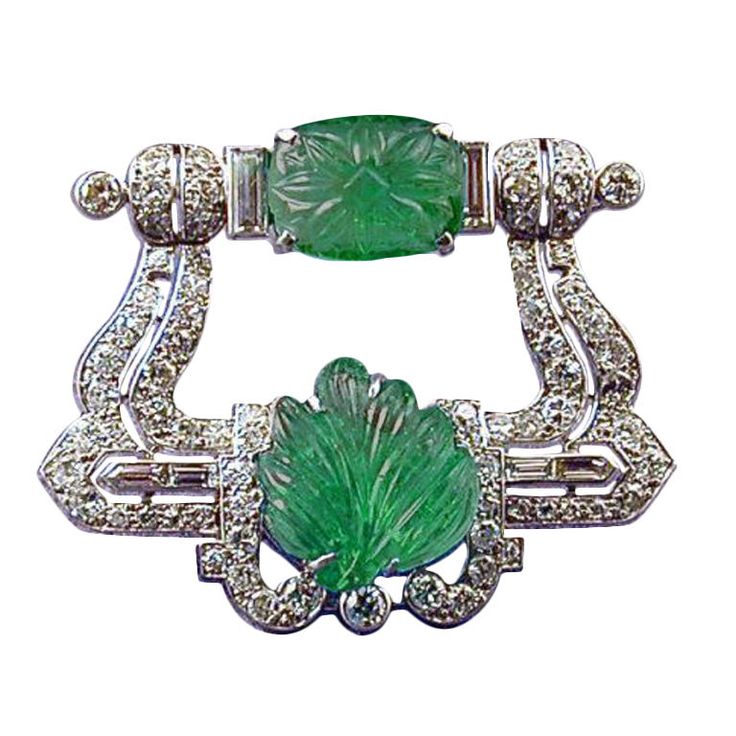 An Art Deco carved Emerald & Diamond brooch