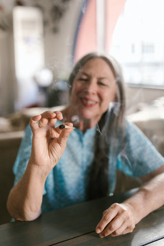 Photo by RODNAE Productions: https://www.pexels.com/photo/an-elderly-woman-smoking-8140240/
