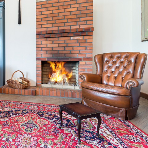 Leather chair sitting beside fireplace