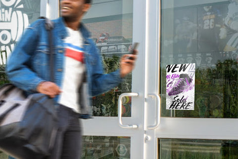 Man walking by store window