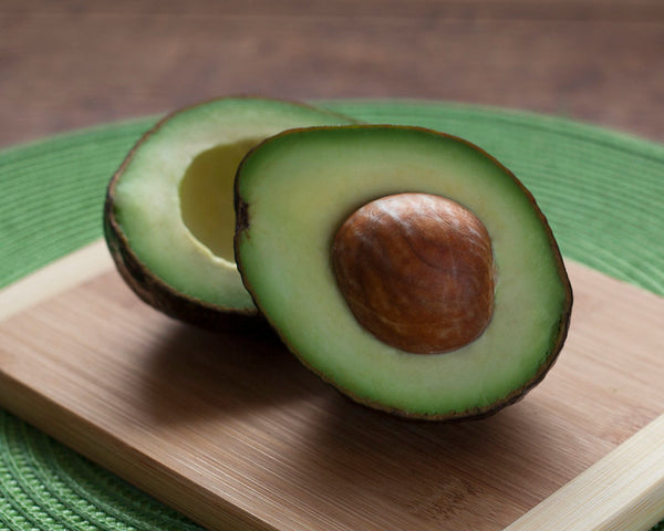 an avocado cut in half