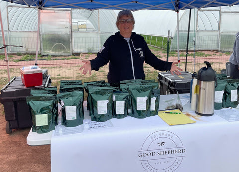 Ellen Otto at a Good Shepherd Coffee Roasters pop-up table.