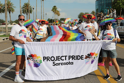 pride activists holding banner