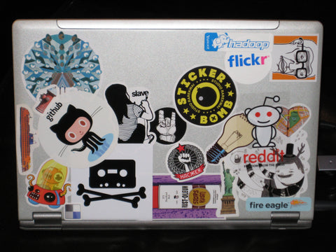 Laptop covered with stickers.