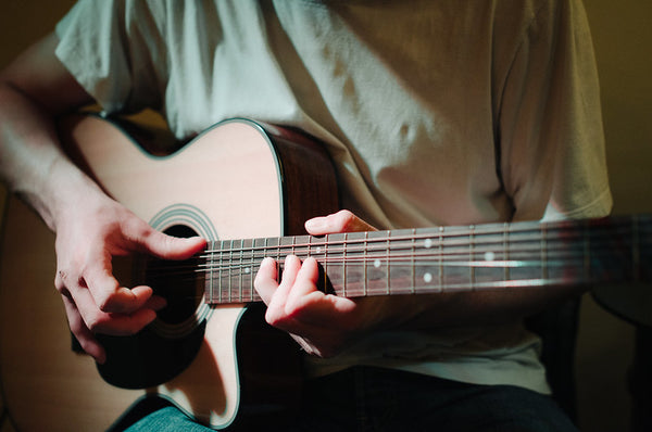 man playing guitar 