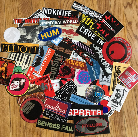 Custom band sticker collection on floor. 
