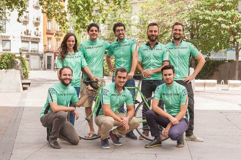 Group of people wearing custom green biking shirts. 
