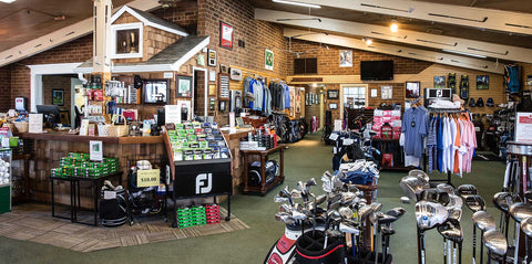 Inside of a golf clubhouse pro shop.