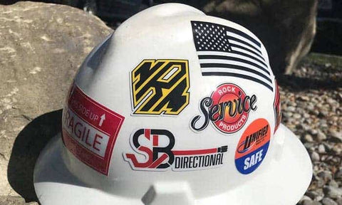 Hard hat with stickers.