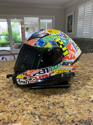 Helmet covered in stickers.