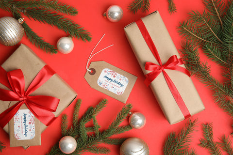 packages with labels on a red holiday background