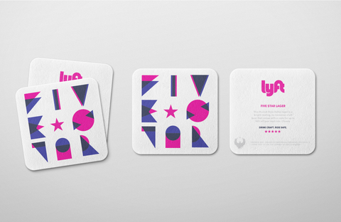 Lyft branded coasters with promo code.