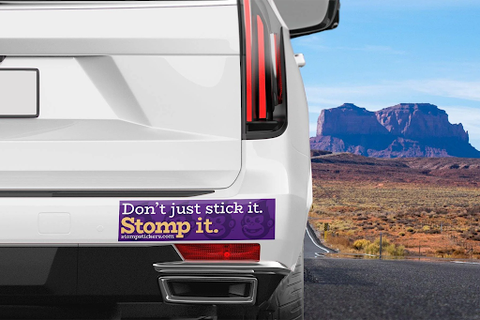 Stomp Stickers bumper sticker on the bumper of a white car.