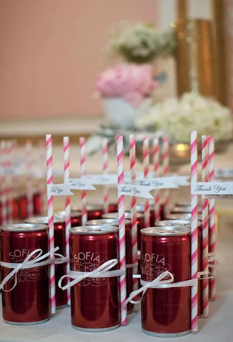 To-go champagne cans at wedding.