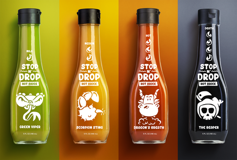 Four hot sauce bottles with clear labels on colorful background.