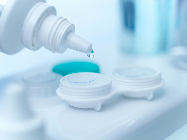 Multipurpose contact lens solution is dripped into a contact lens case