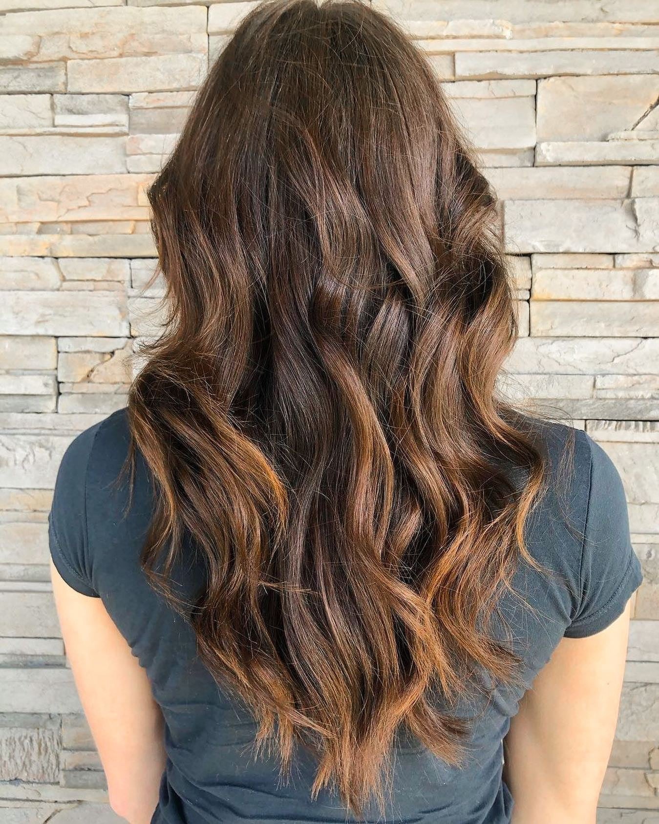 9. Textured Brunette with Copper Accents - Long Layered Hairstyles