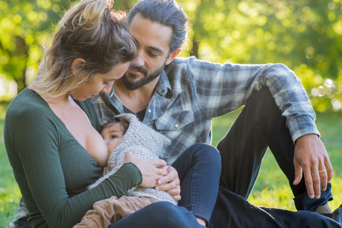 father looks at nursing mother- US maternity leave compared to other countries- Mila's Keeper