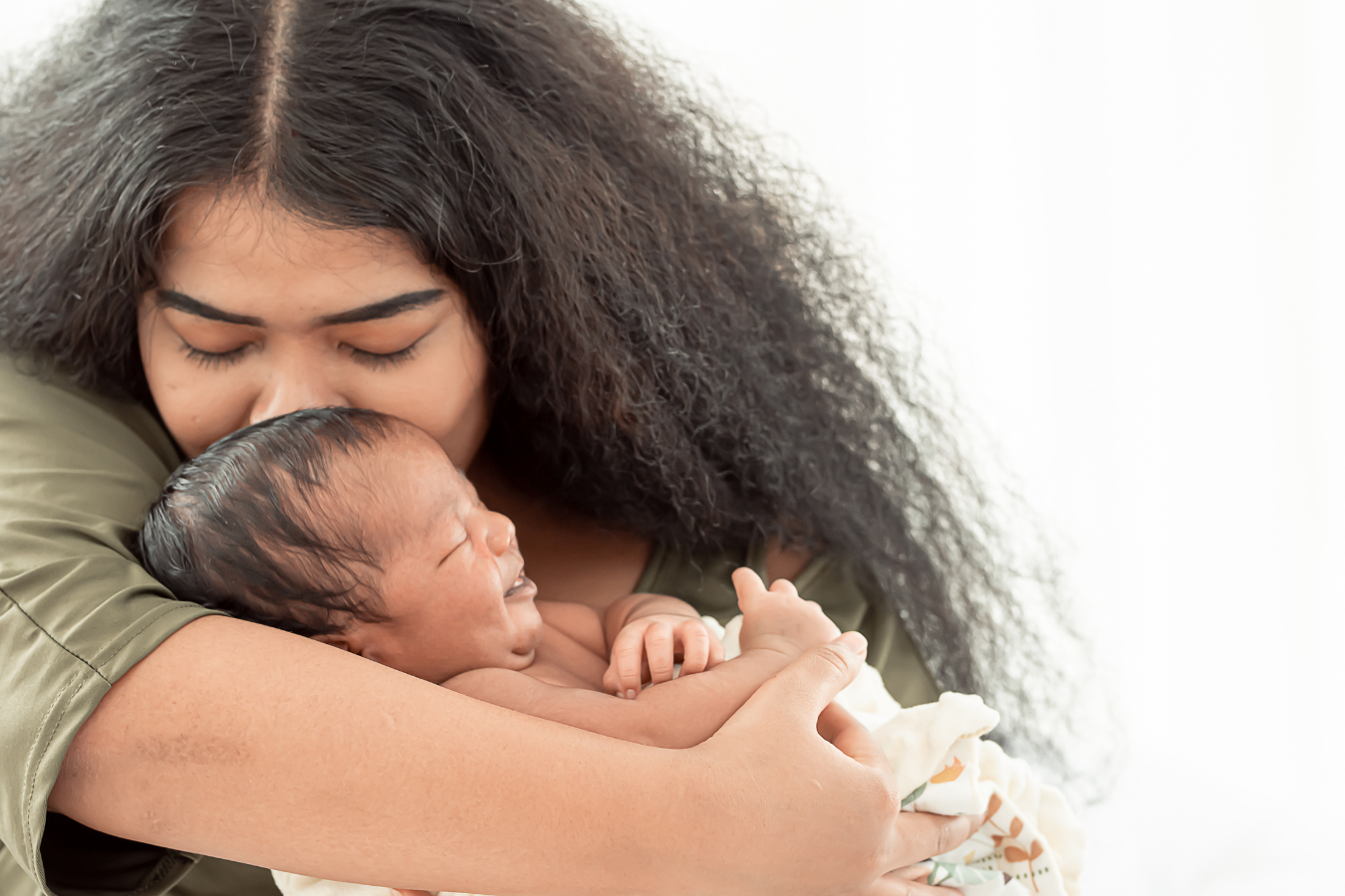 woman and baby-  lactation room requirements- Mila's Keeper