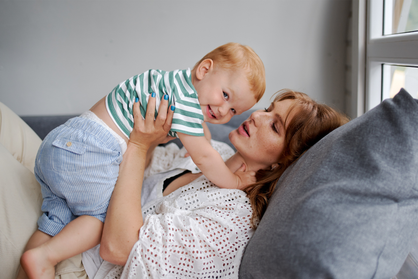 woman snuggles baby-botox while nursing- Mila's Keeper