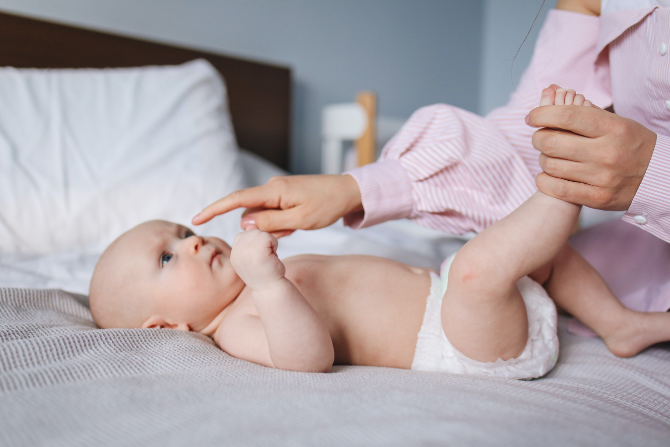 woman plays with baby-fillers while breastfeeding-Mila's Keeper