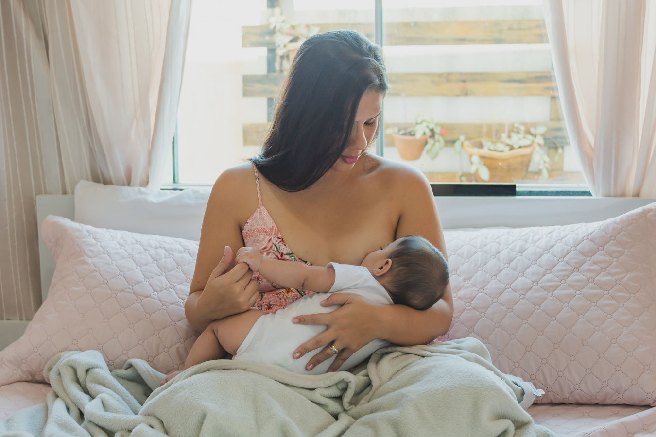 woman breastfeeds baby-can you get botox while breastfeeding-Mila's Keeper