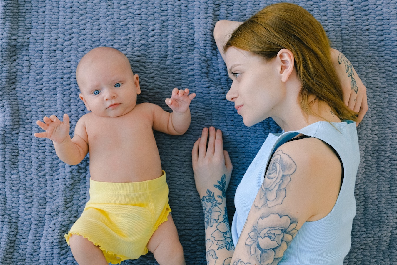 mom and baby laying down/can-you-get-a-tatoo-while-breastfeeding