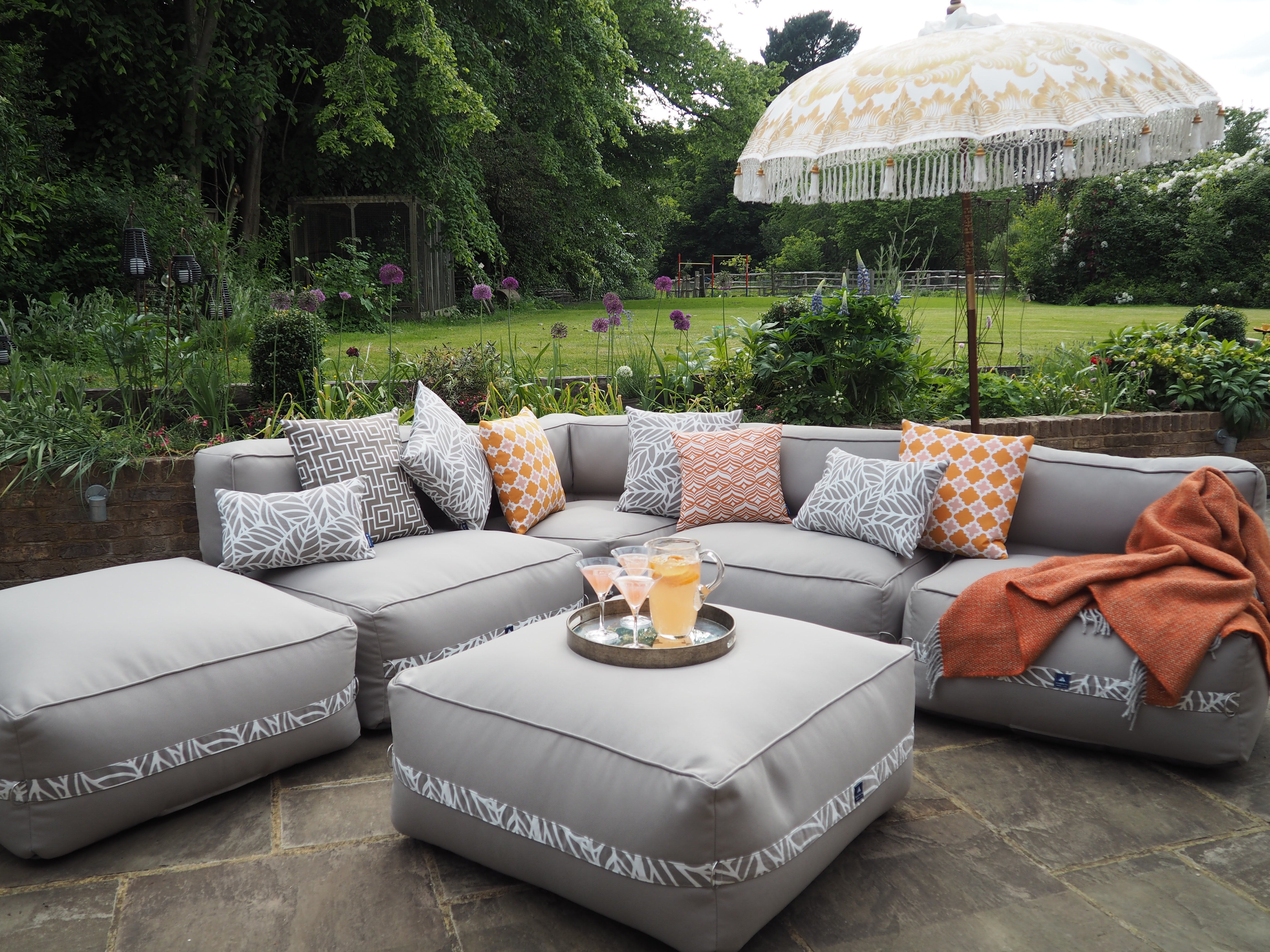 A garden sofa ready for guests outdoors on the patio