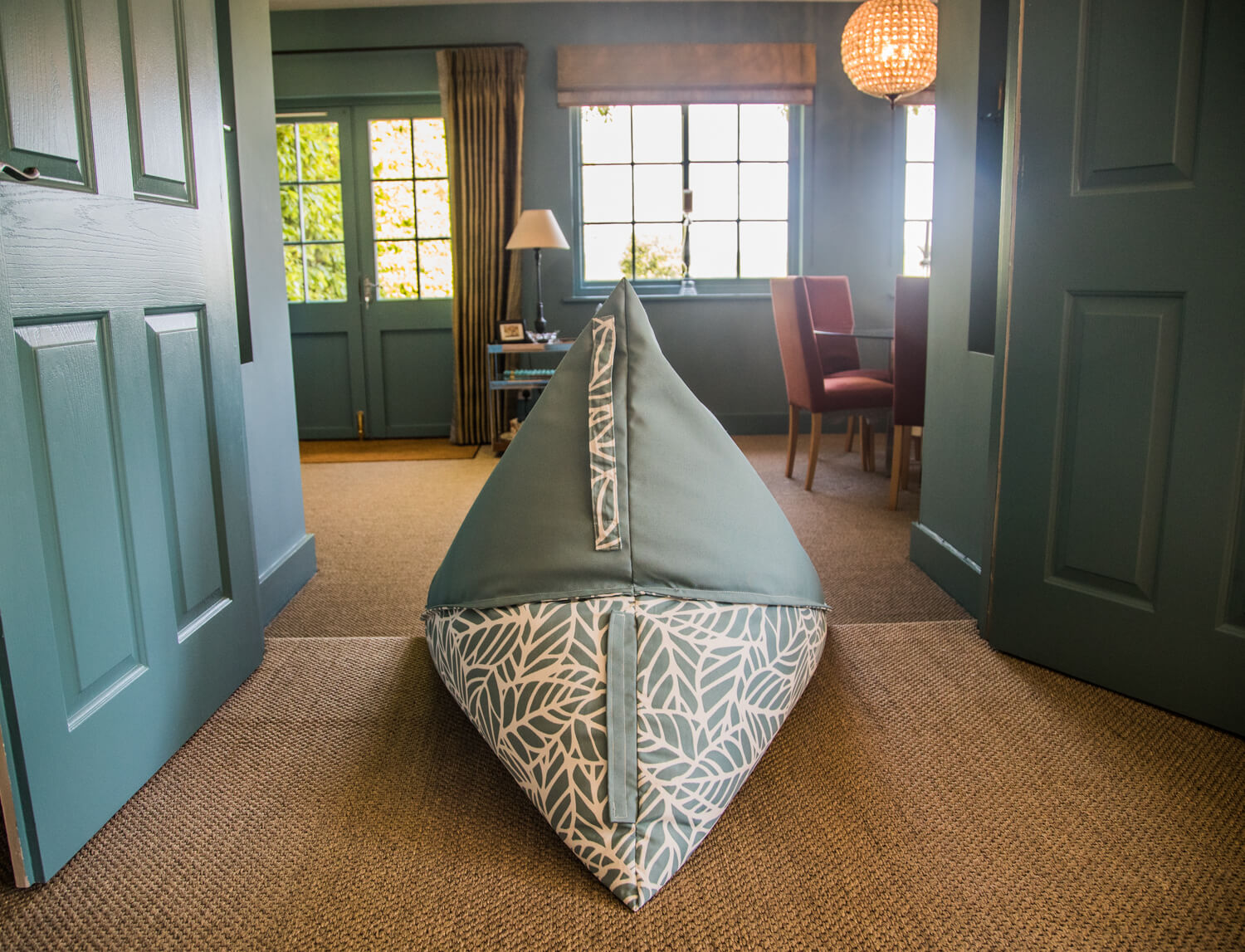 An ocean blue beanbag chair sat as perfectly indoors as would it be in the garden.