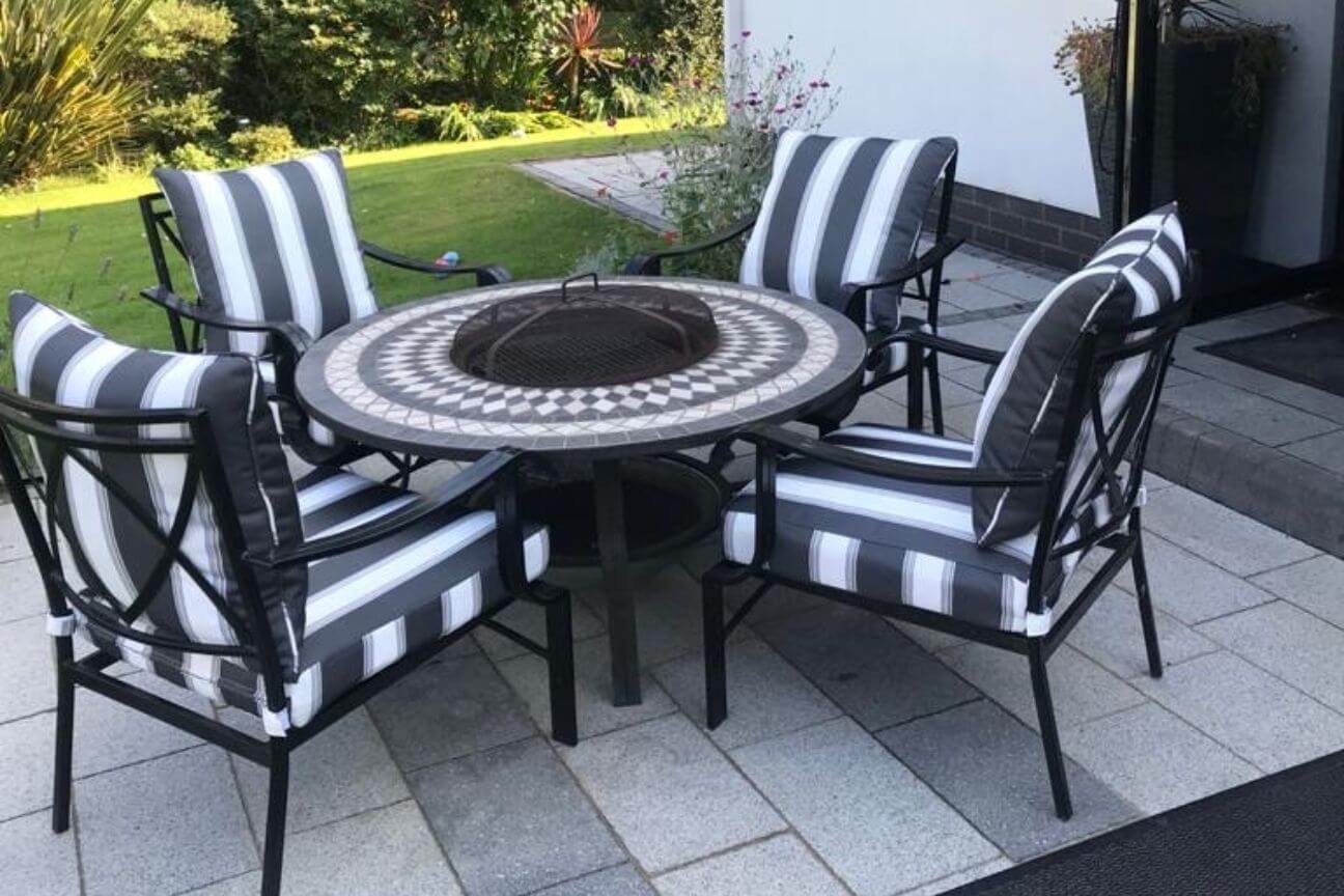 Bistro table and chairs covered with bespoke black and white striped cushions