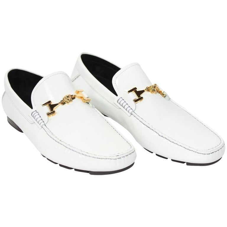 white and gold versace loafers