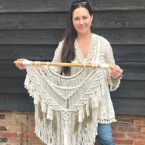 Kylie holding a large Grecian Goddess Wall Hanging 