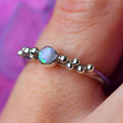Opal and silver ring with beads of silver surrounding opal
