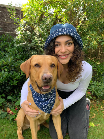 Hannah and Leo the Labrador wearing matching bandana and upcycled denim bucket hats in Midnight Star print for Twin With Your Dog Day 