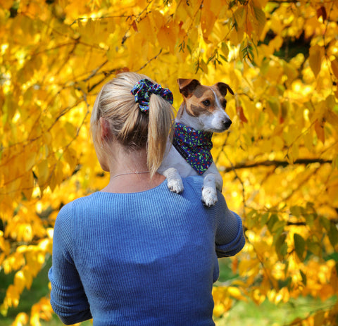 Kate and her dog Gertie wearing matching bandana and hair scrunchie for twin with your dog day