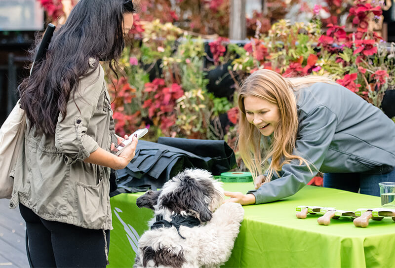 Women and dog at Benebone event