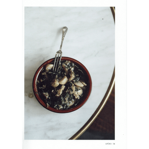 Photograph of Escarfaux dish on marble table from the Grater Good Cookbook