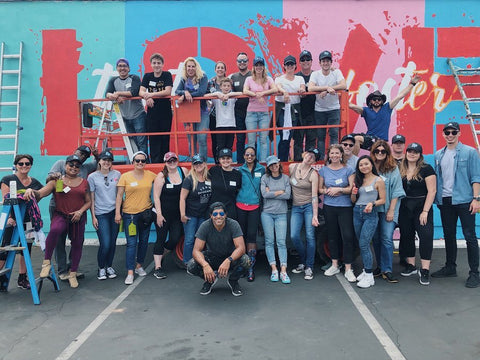 Ruben Rojas and team at the finished mural titled "Together We Foster Love"