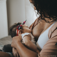 black mom breastfeeding baby