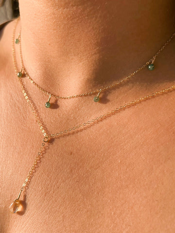 citrine lariat necklace and emerald gold necklace layered