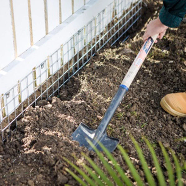 A person shoveling dirt