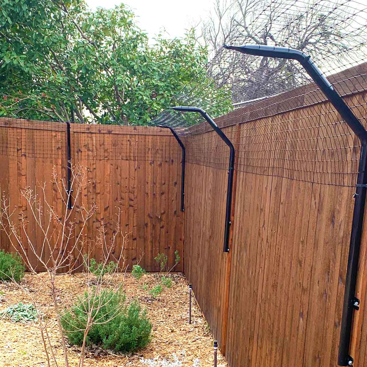 Fence topper system on a wooden fence
