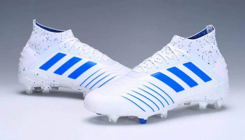 white and blue adidas soccer cleats