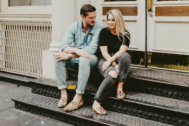 Alex is wearing kilim slide and Chris is wearing mens kilim loafers in their engagement shoot in soho nyc.
